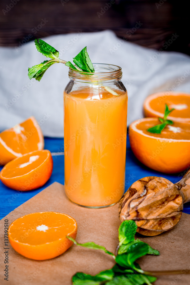 healthy morning with orange juice in bottle on kitchen background