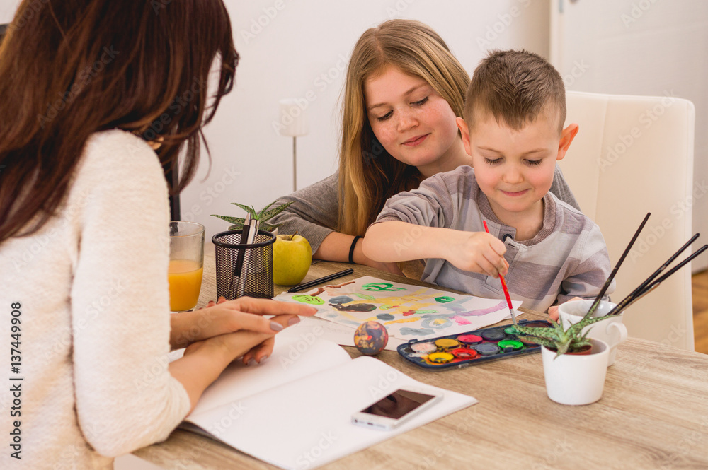 Happy family painting at home