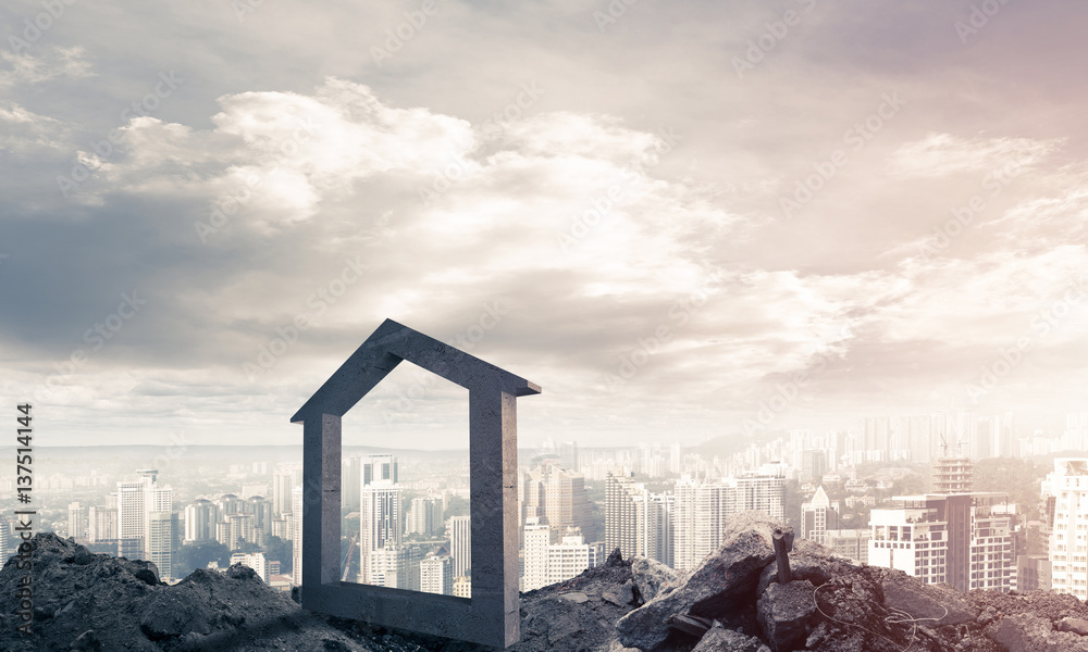 Conceptual image of concrete home sign on hill and natural lands