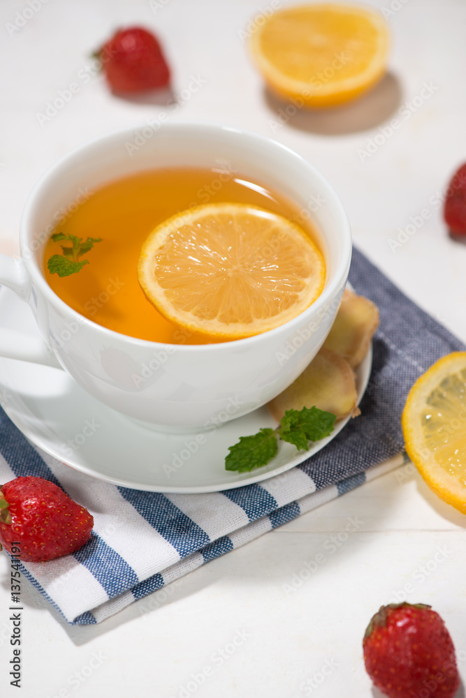 Healthy ginger tea ingredients on a wooden table