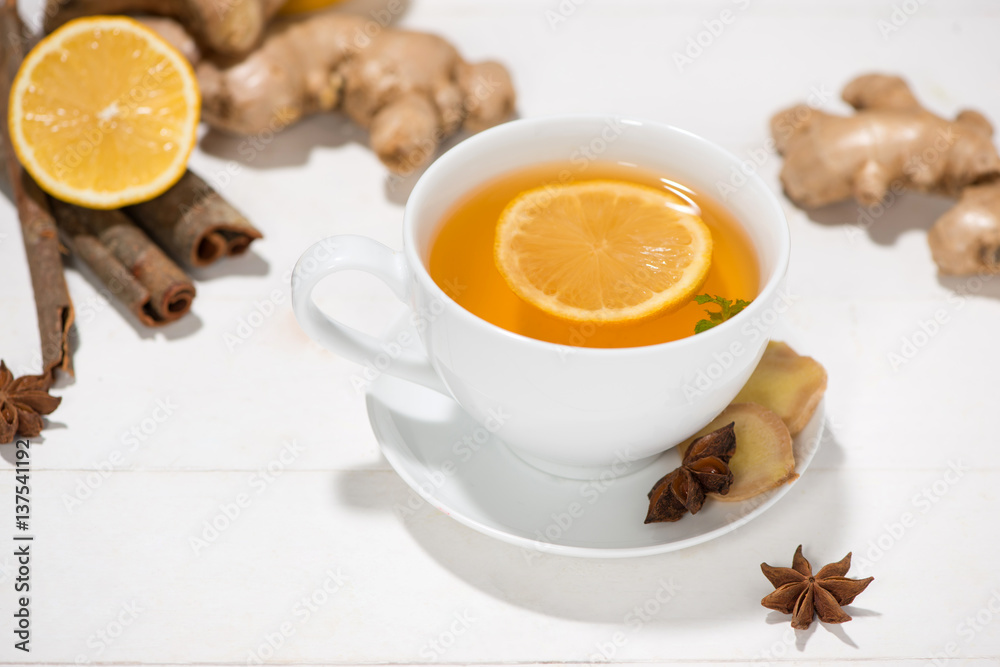 Healthy ginger tea ingredients on a wooden table