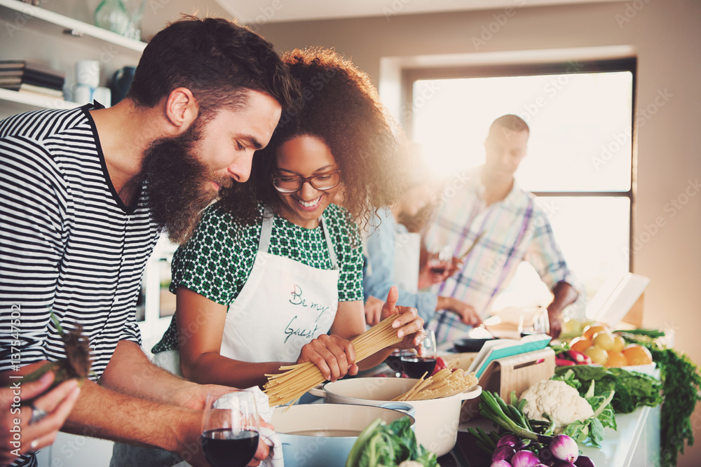 Group of friends making dinner