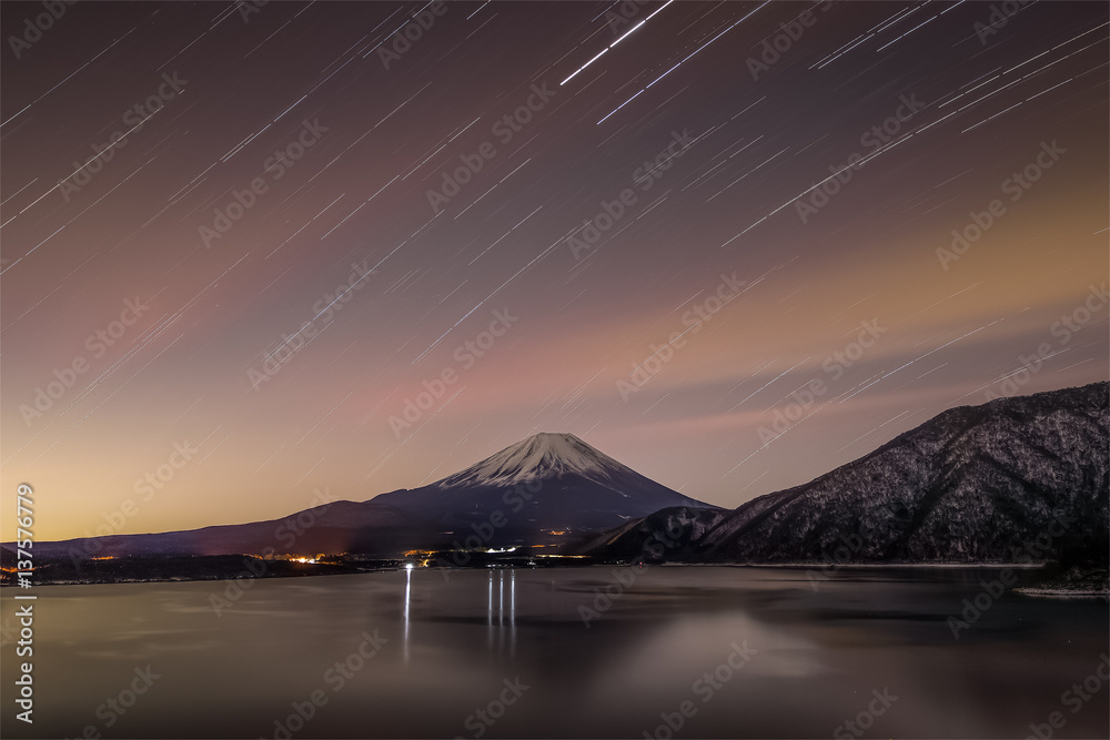 Mountain Fuji and Lake Motosu at night in winter