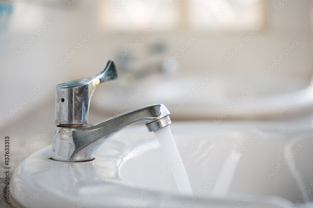 Faucet in the public toilet