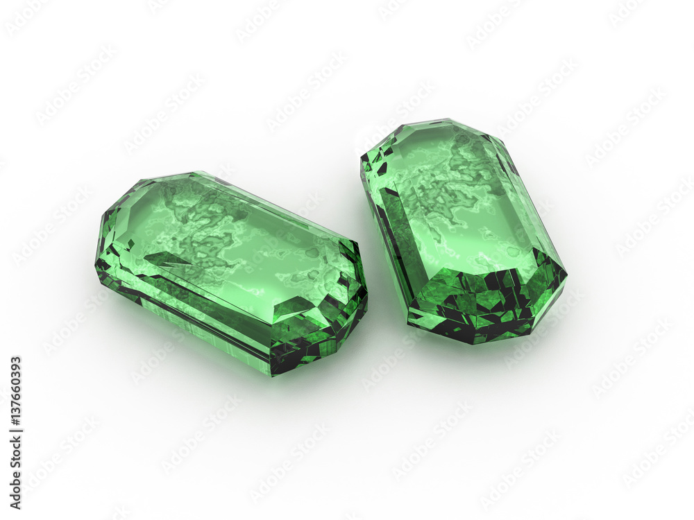 Emeralds isolated and reflected on rough white background.