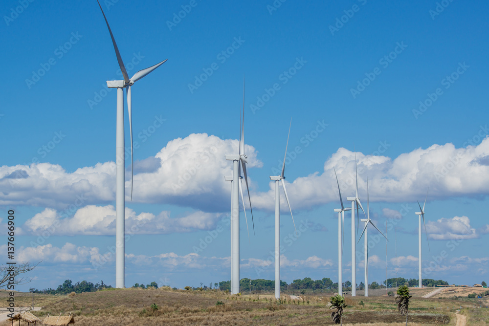 Wind Turbine for alternative energy on mountain with blue sky. Eco power