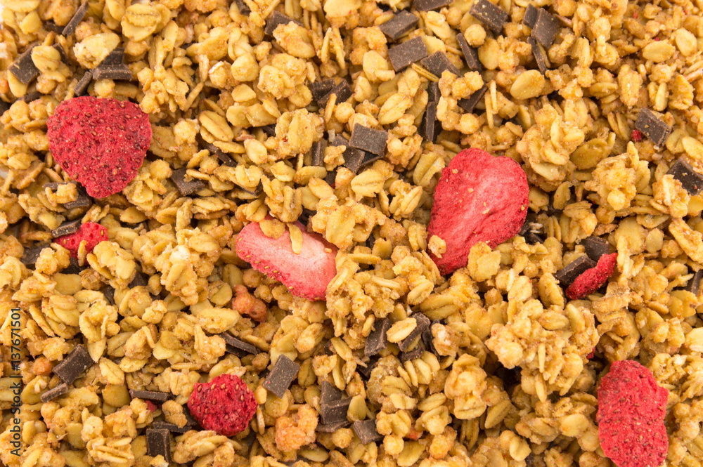 Dry strawberries and cereals close up