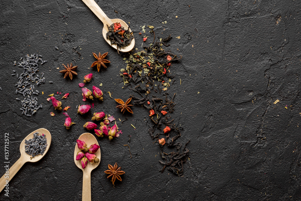 Herbs on spoons black background mockup top view