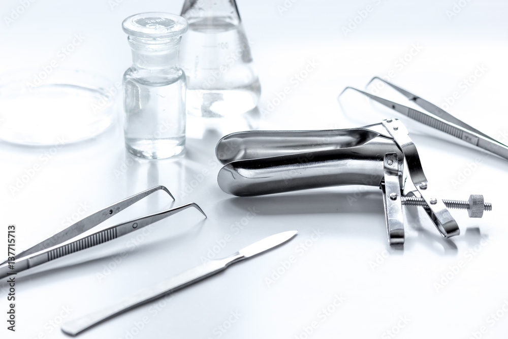 instruments of gynecologist on white background