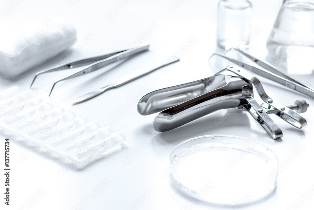 instruments of gynecologist on white background