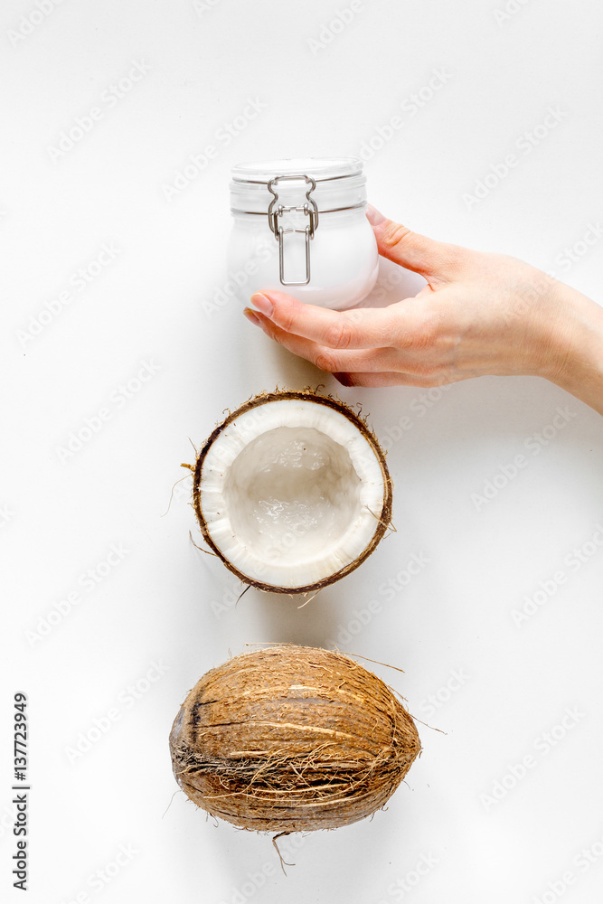 organic cosmetics with coconut on white background top view