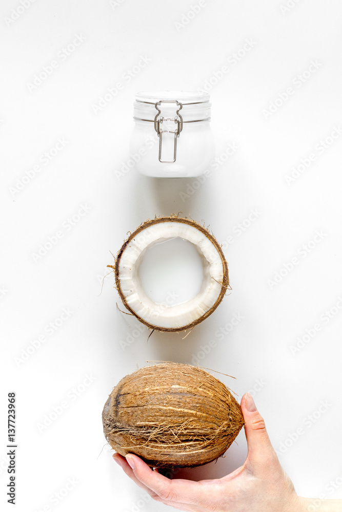 organic cosmetics with coconut on white background top view