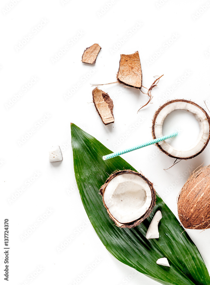 cocktail with coconut on white background top view