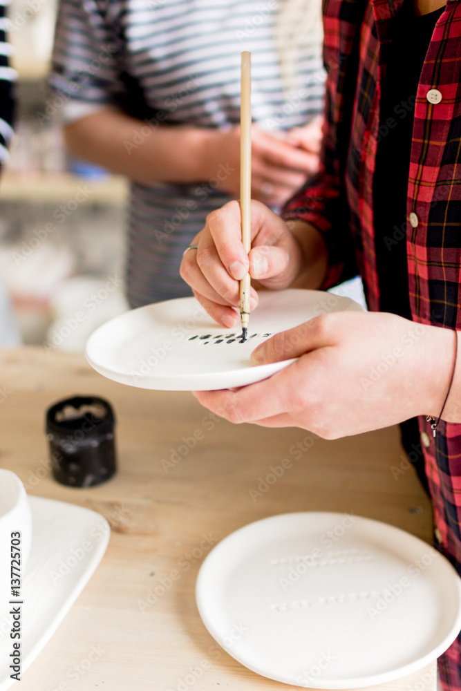 workshop production of ceramic tableware product painting