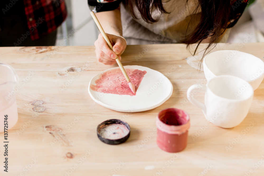 workshop production of ceramic tableware product painting