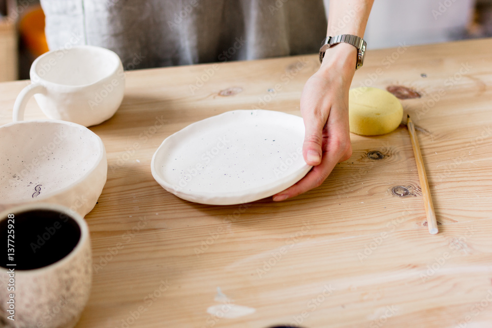 workshop production of ceramic tableware product painting