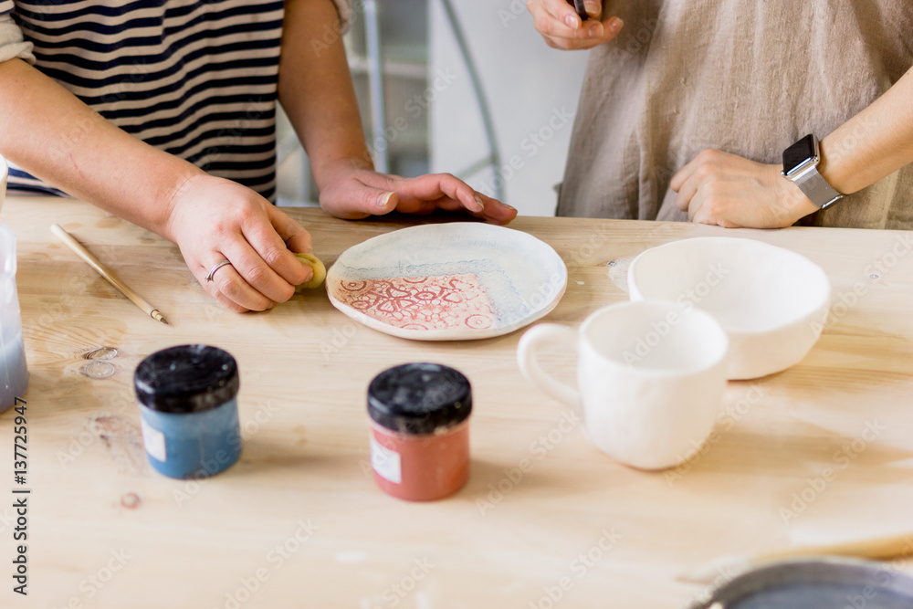 workshop production of ceramic tableware product painting