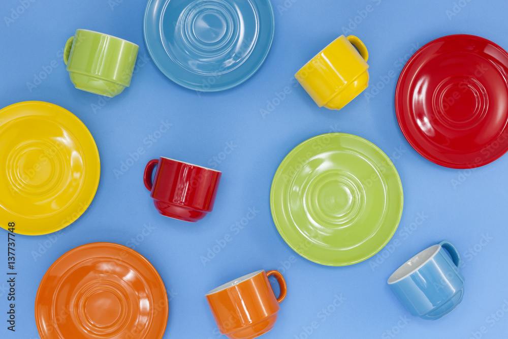 colorful coffee cups on blue background.