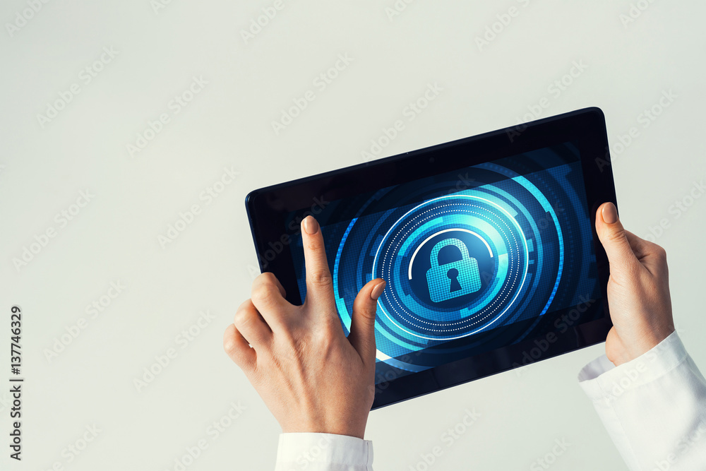 Close of female doctor hands working with tablet pc computer