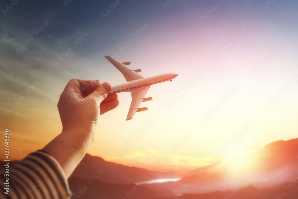 Child plays with a toy airplane