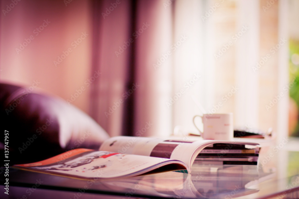 selective focus of stacking magazine place on table in living room