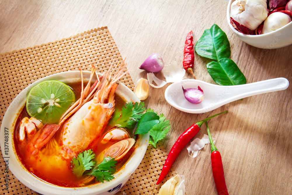 Close up Asian Spicy soup with shrimp in  bowl , famous Thai food cuisine calling Tom Yum Kung