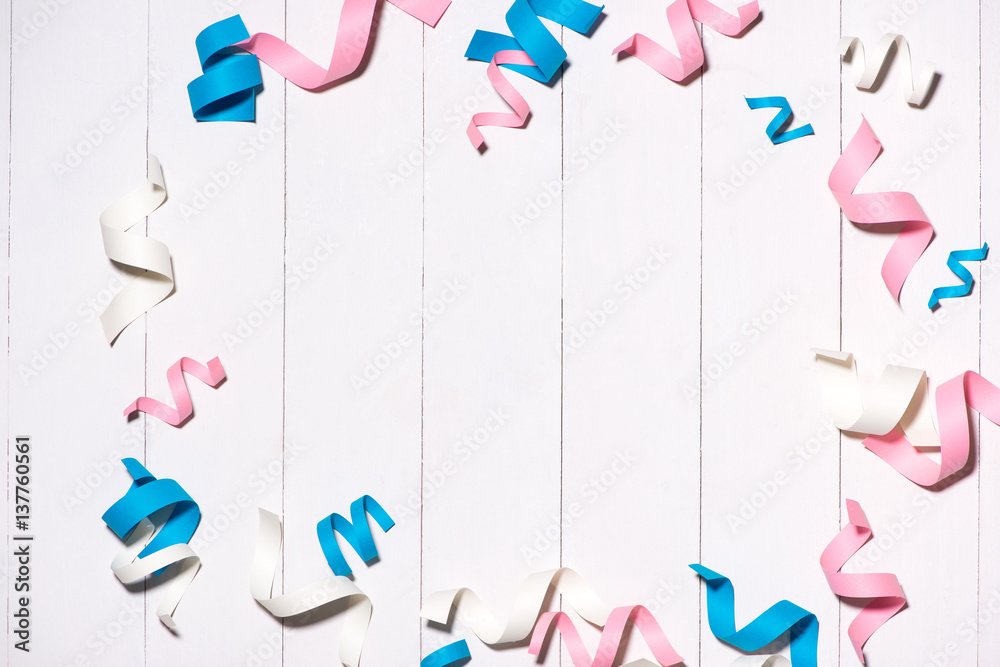 Celebration Flat lay with colorful party items on wooden background.