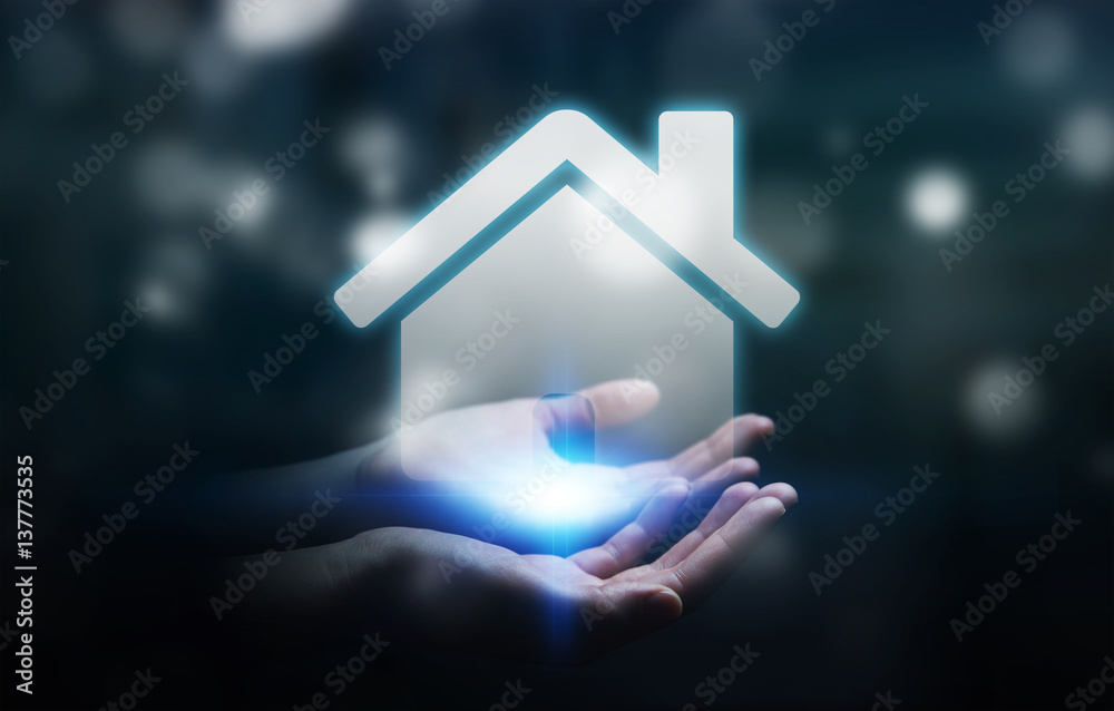 Businessman holding 3D rendering icon house in his hand