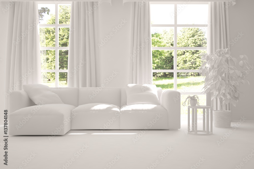 White room with sofa and green landscape in window. Scandinavian interior design