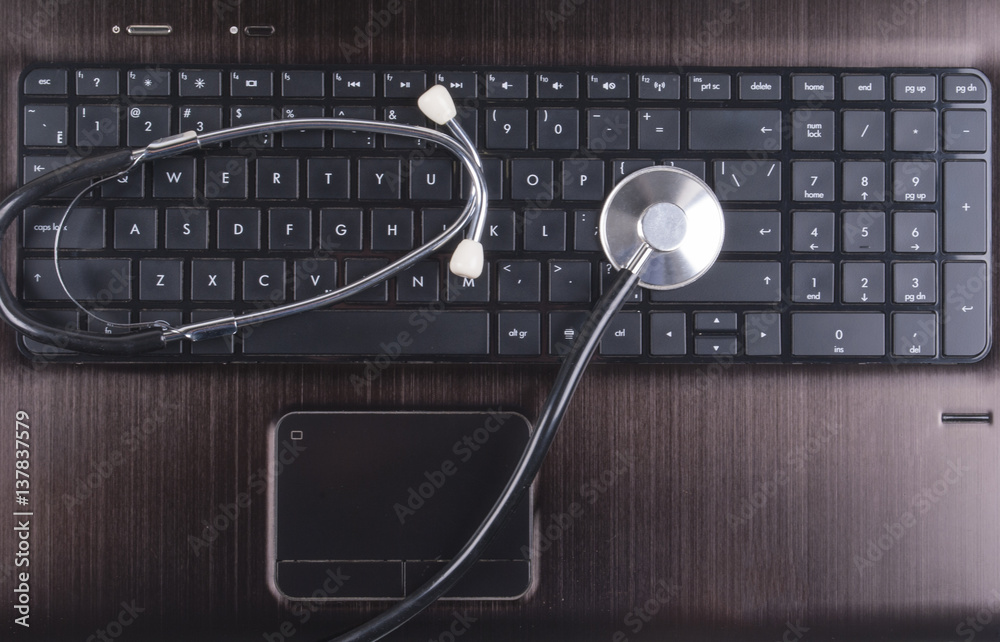 Stethoscope on a computer keyboard