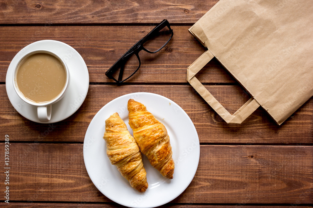 Business breakfast with coffee and croussant top view