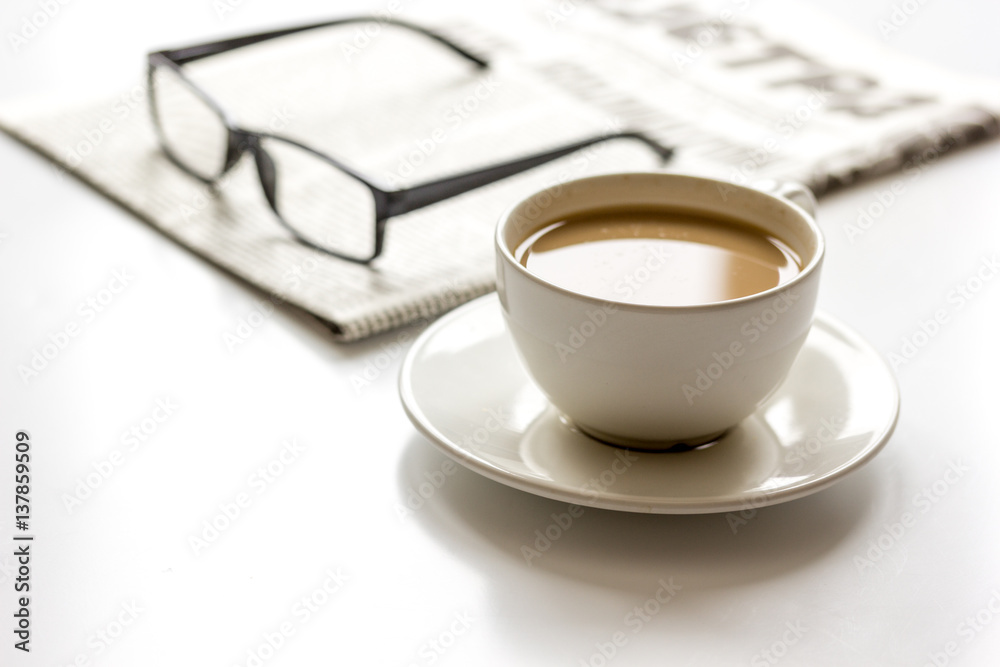 Business lunch with coffee and newspaper on white table top view