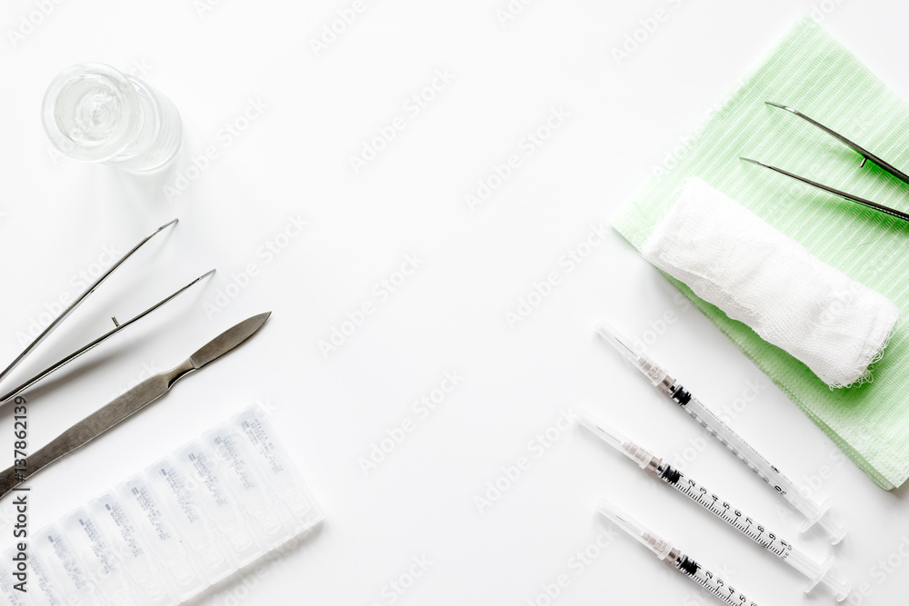 instruments of gynecologist on white background top view mock up