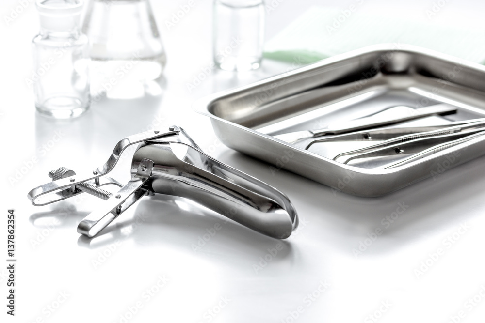 instruments of gynecologist on white background