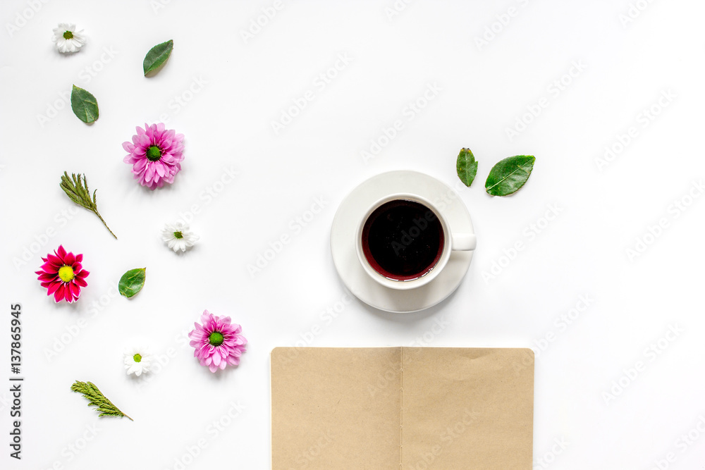 Froral flat lay with cup and notepaper top view mockup