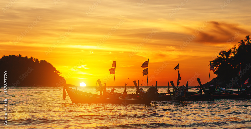 boat at sea against the backdrop of sunset