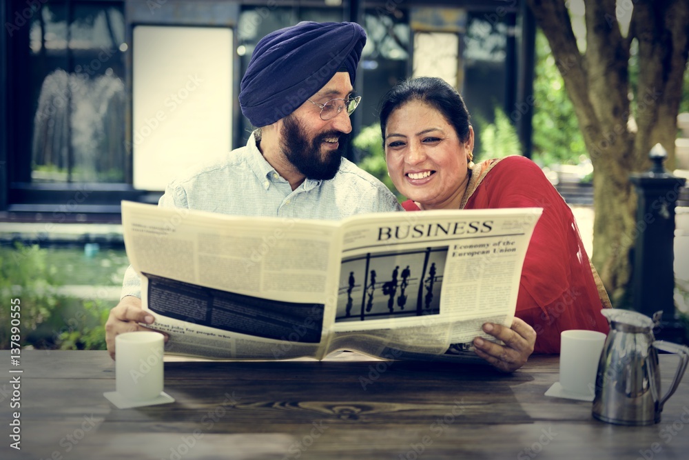 Indian Couple Reading Newspaper Concept