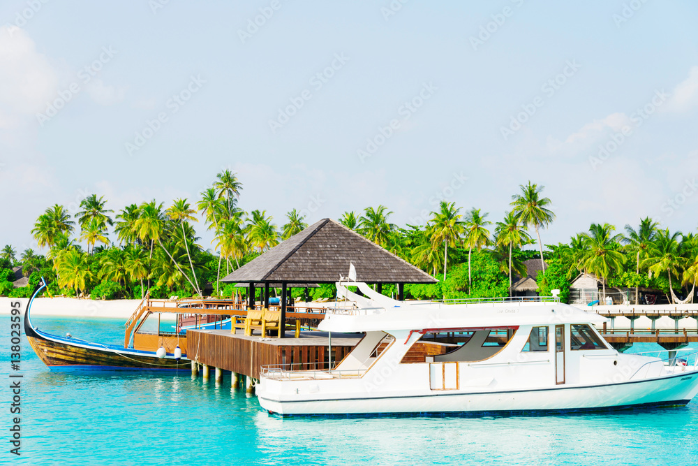 tropical dock with beautiful yacht