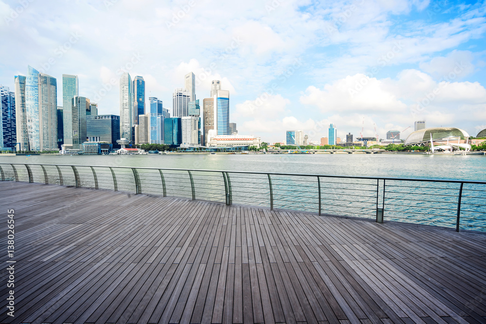 cityscape and skyline of modern city from wood footpath