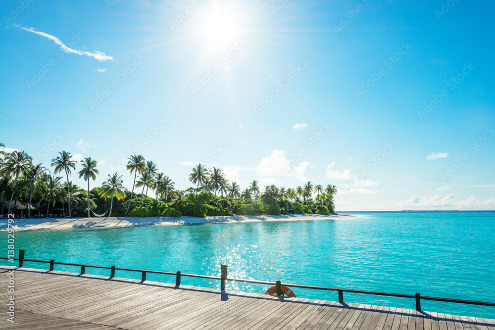 beautiful tropical sea with wood house in blue sky