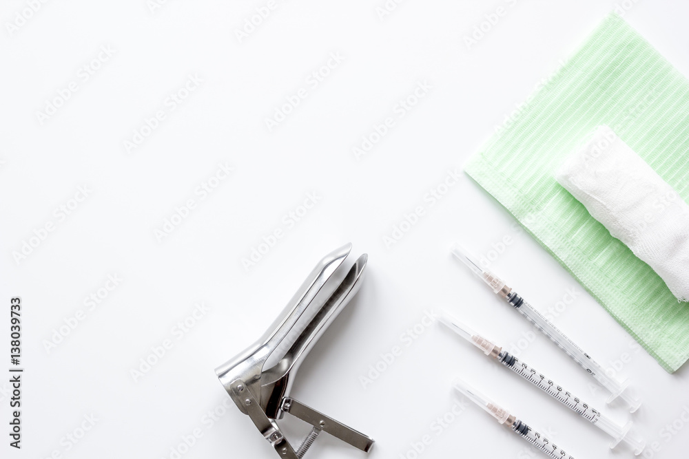 instruments of gynecologist on white background top view mock up