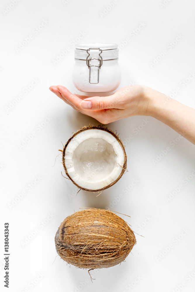 organic cosmetics with coconut on white background top view