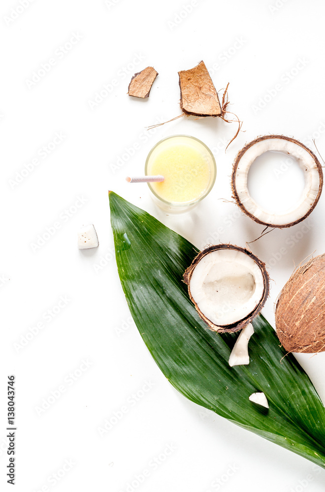 cocktail with coconut on white background top view