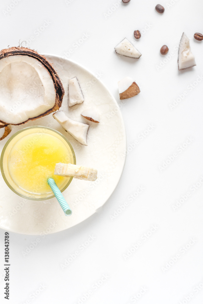 cocktail with coconut on white background top view