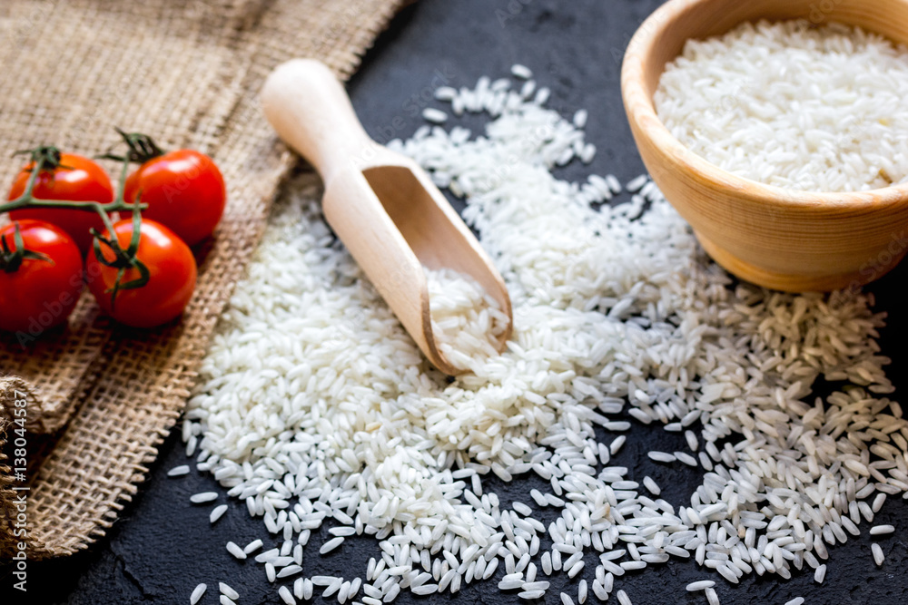 ingredients for paella on dark background