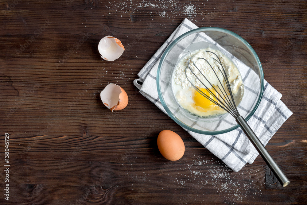 cooking pancake on wooden background top view ingredients for making