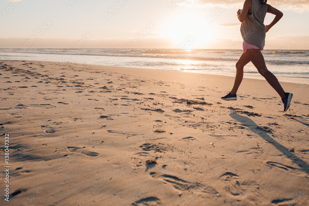 Female exercising on the beach