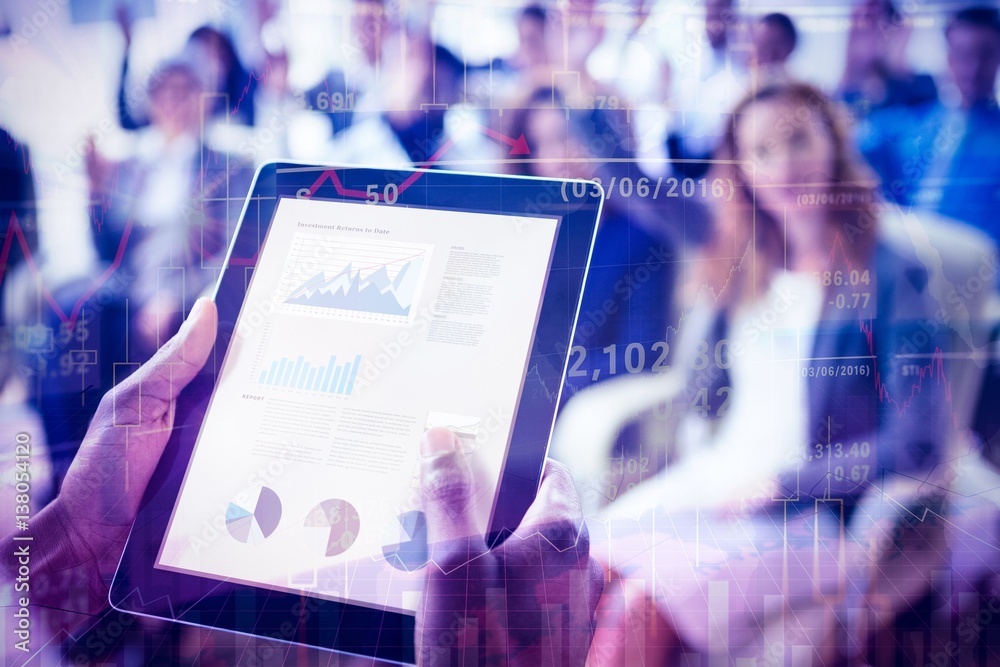 Businessperson using digital tablet during meeting