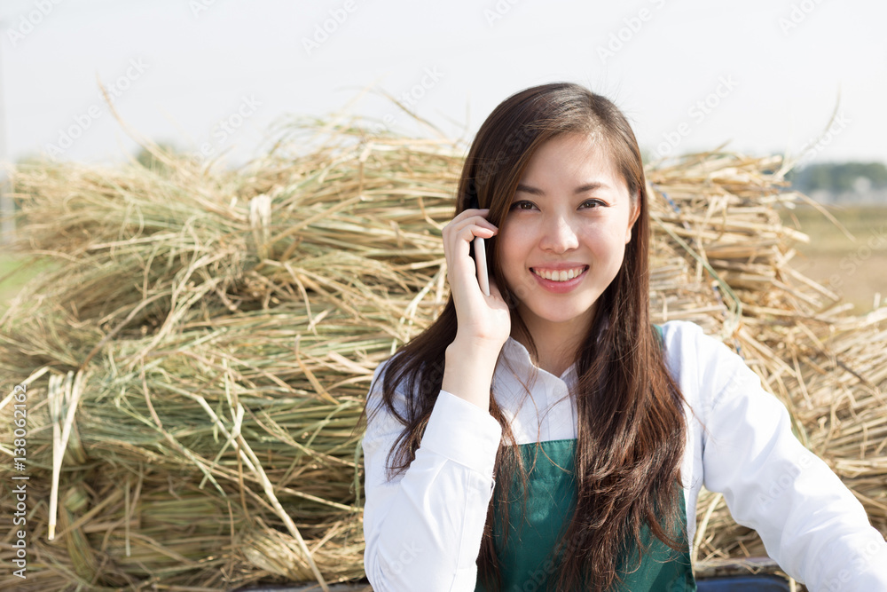 young asian woman agronomist in gold field