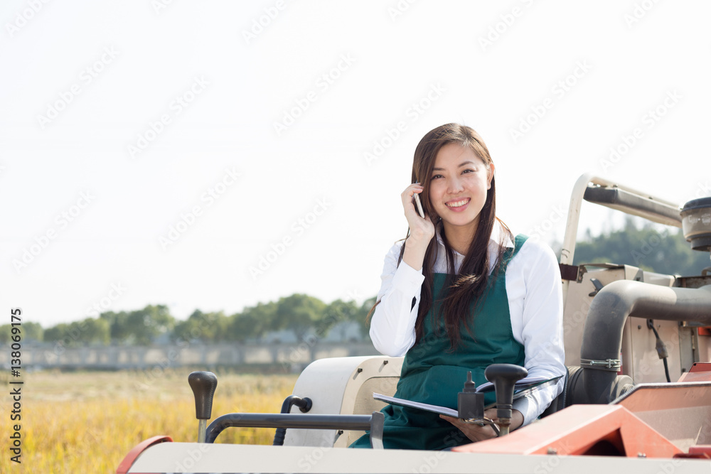 young asian woman agronomist in golden field